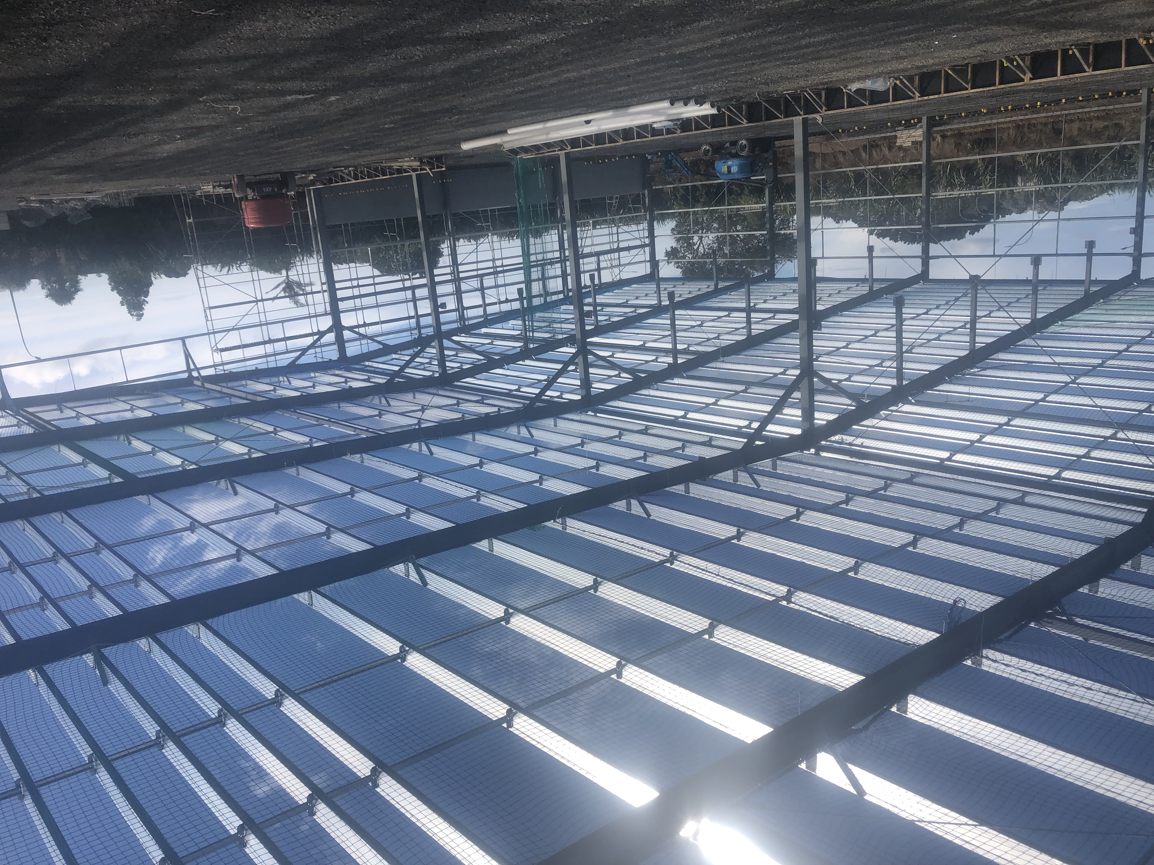Safety netting installed below a roof frame
