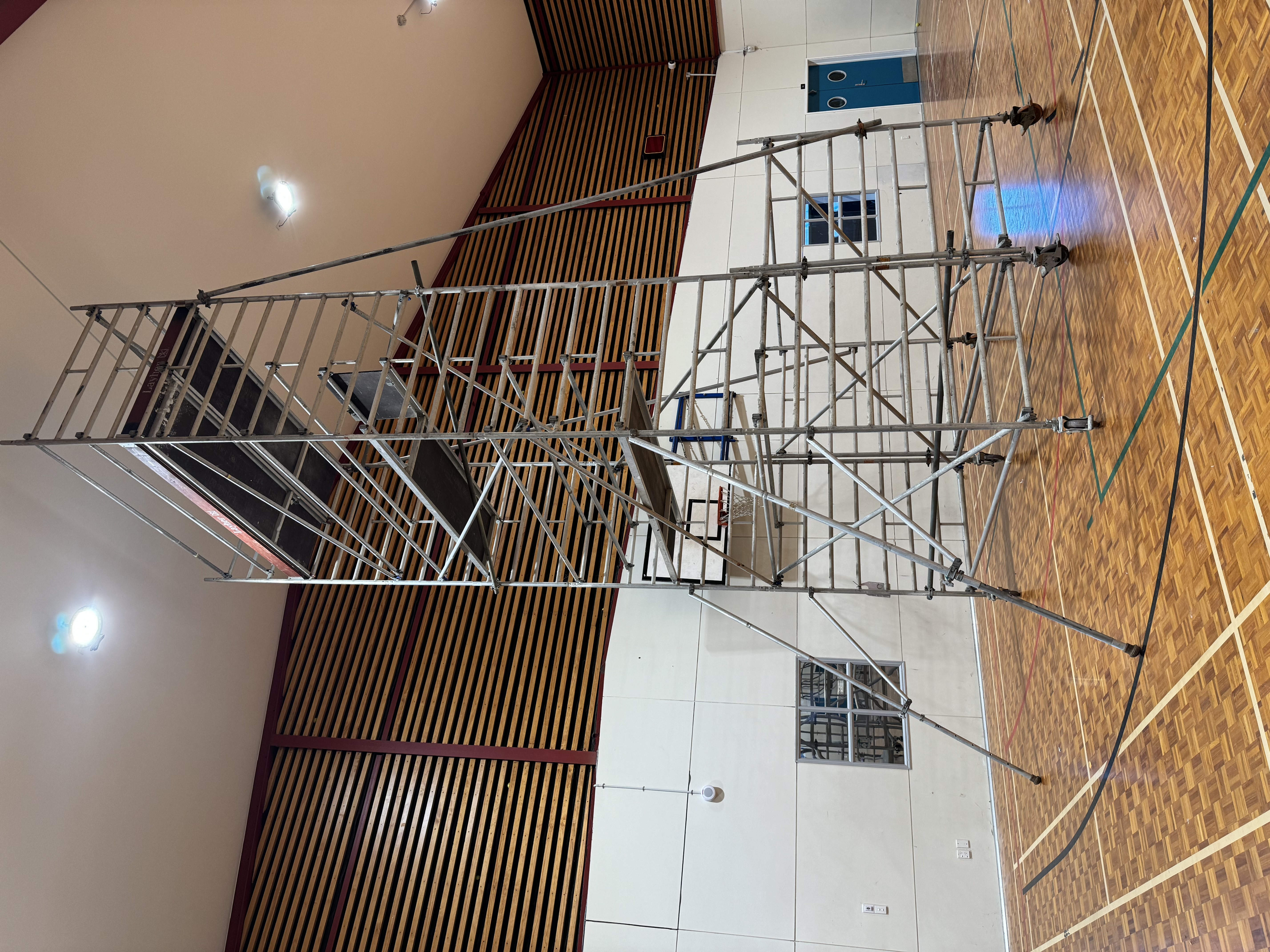Mobile scaffold tower beside a building