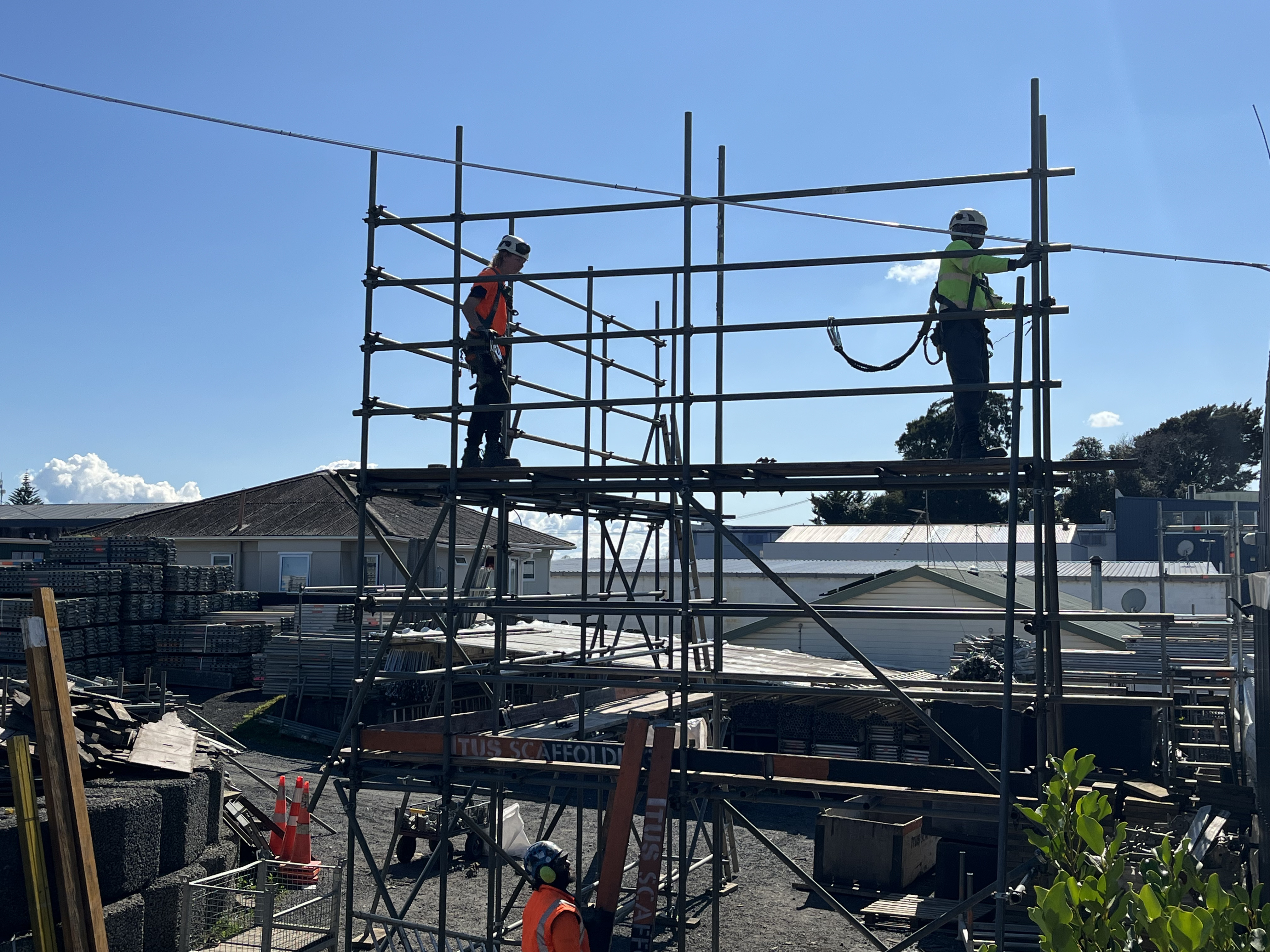 Residential scaffolding set up beside a home